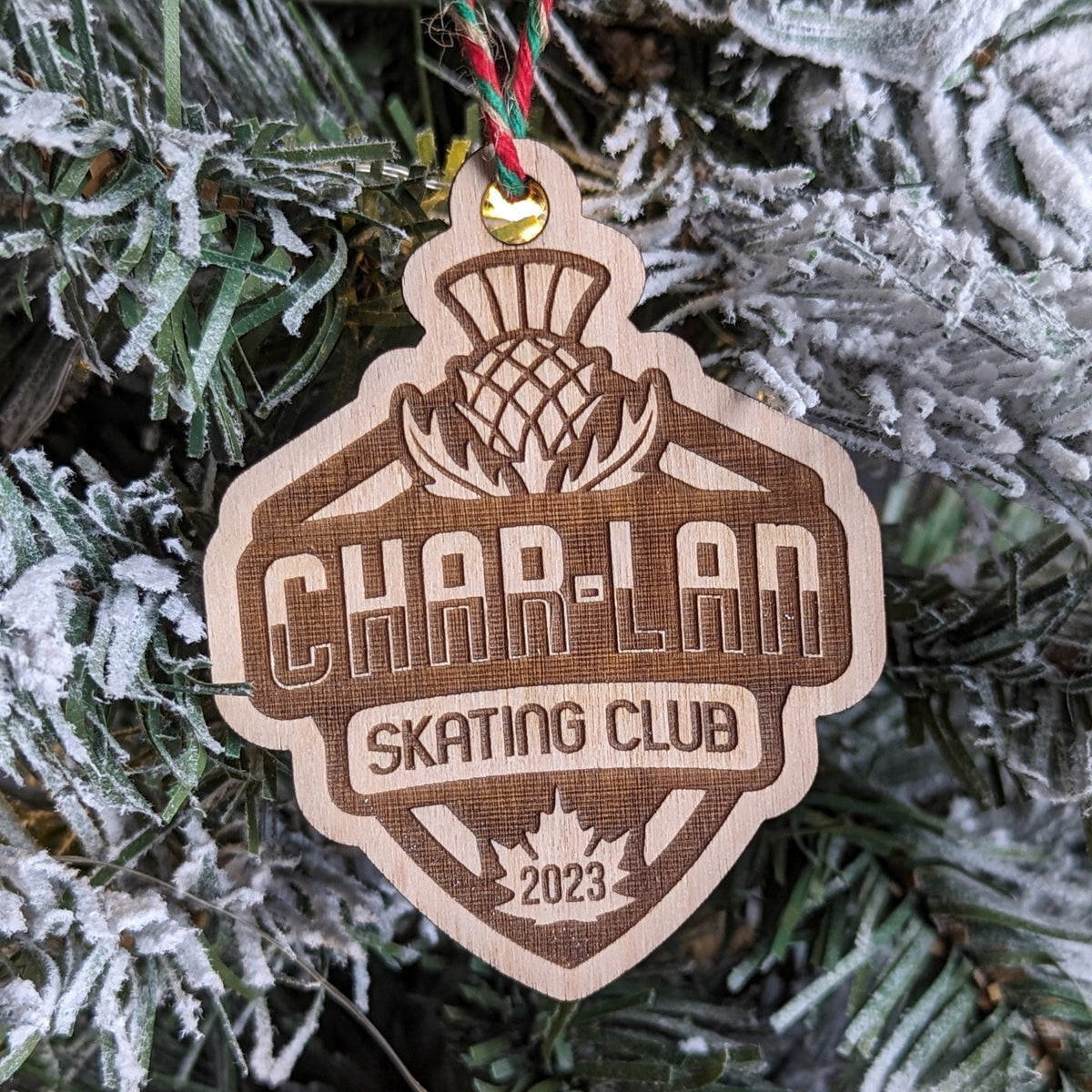Custom laser engraved wood crest ornament made for a skate club