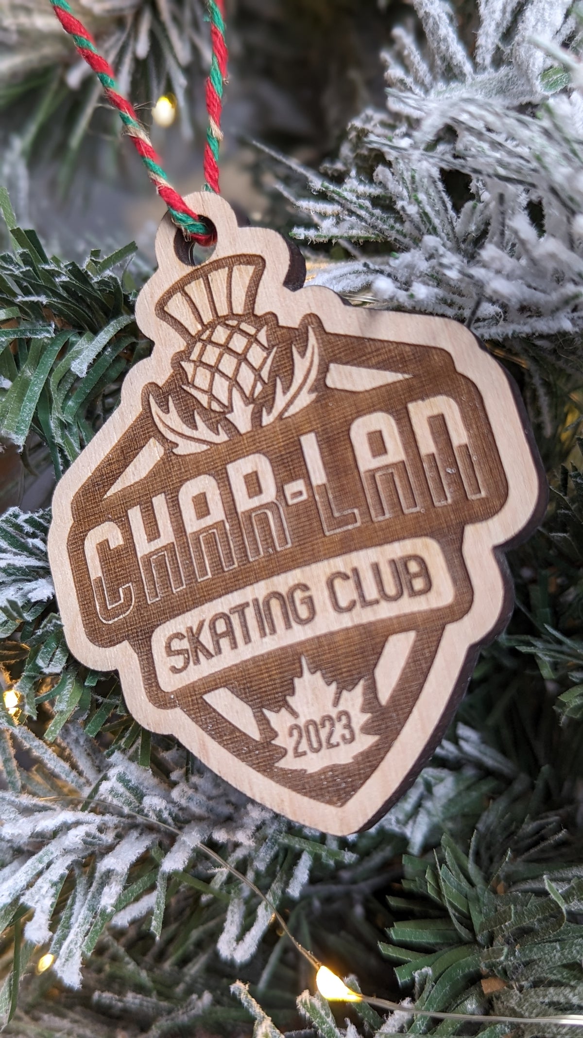 Engraved wood logo ornament detail