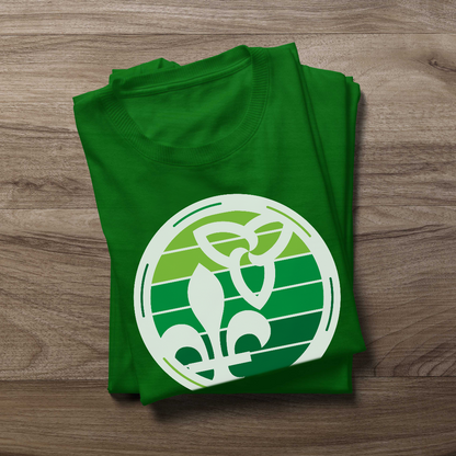 Folded Retro-Inspired Franco-Ontarien Shirt on a wooden background, featuring a design with the trillium and fleur-de-lys.