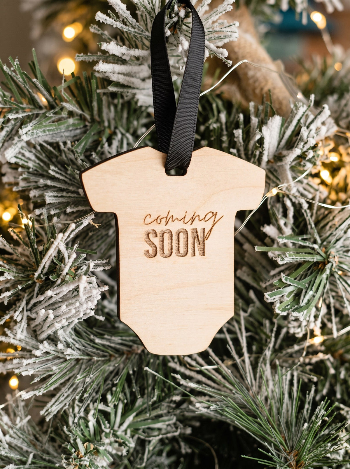 Wooden onesie ornament engraved Coming Soon on a Christmas tree