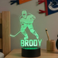 Hockey-themed night light with  the name 'Brody' on a desk