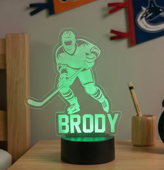 Hockey-themed night light with  the name 'Brody' on a desk
