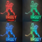 Four hockey-themed night lights with the name 'Brody' in different colors on a dark background.