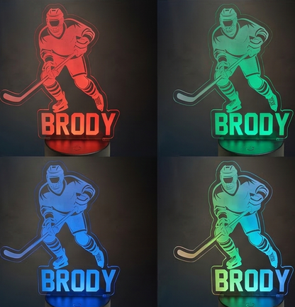 Four hockey-themed night lights with the name 'Brody' in different colors on a dark background.