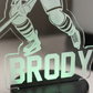 Glowing acrylic plaque with hockey player silhouette and 'Brody' text on a dark background