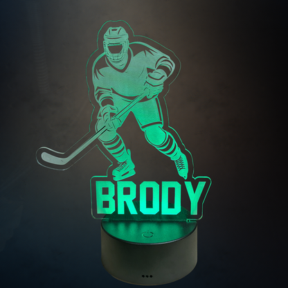 Hockey-themed night light with 'BRODY' on a dark background