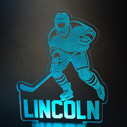 Light-up sign with hockey player silhouette and 'LINCOLN' text on a dark background