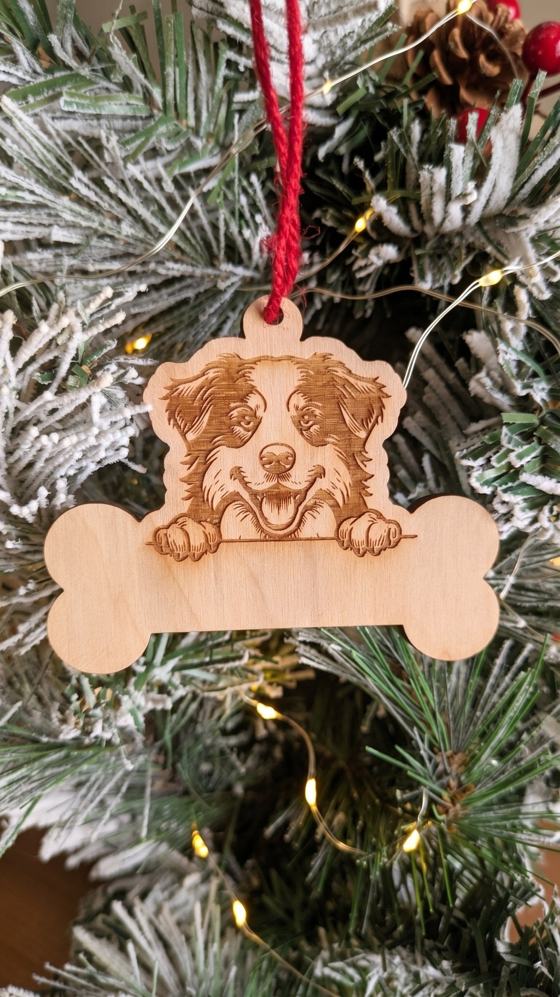Personalized dog bone ornament with engraved border collie portrait