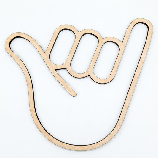 wooden cutout of a hand in the shaka sign position on white background
